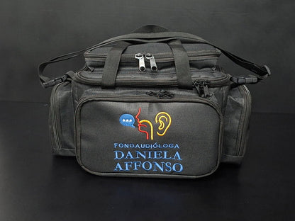 Bolsa profissional personalizada com a logo do cliente, cor preta com alça e tira colo.